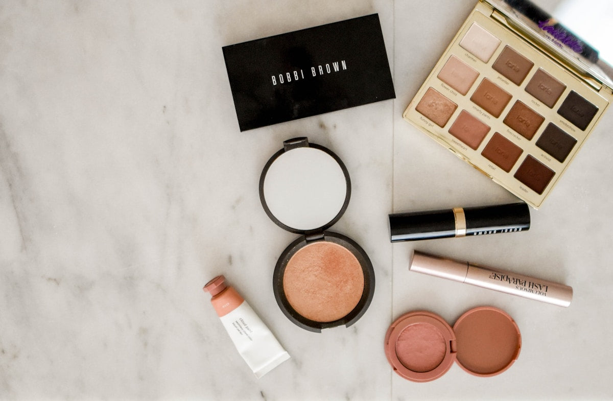 Makeup brushes and cosmetics flatlay